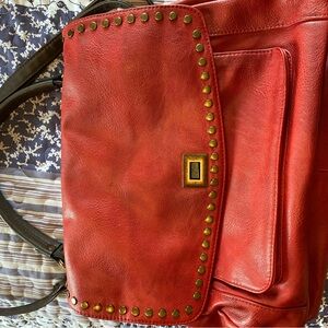 Red PU satchel. Can be worn crossbody.